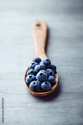 Photo: Blueberries on a wooden spoon Blueberries on a wooden spoon