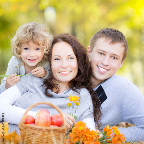 Photo: Happy family in autumn park Happy family in autumn park