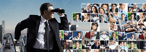 Photo: Businessman with binoculars. Businessman with binoculars.