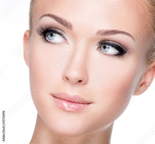 Photo: portrait of beautiful white woman with long false eyelashes portrait of beautiful white woman with long false eyelashes