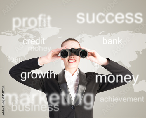 Photo: business woman looking through binoculars business woman looking through binoculars