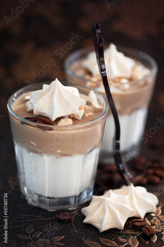 Photo: Dessert with meringue and custard in glass, selective focus Dessert with meringue and custard in glass, selective focus