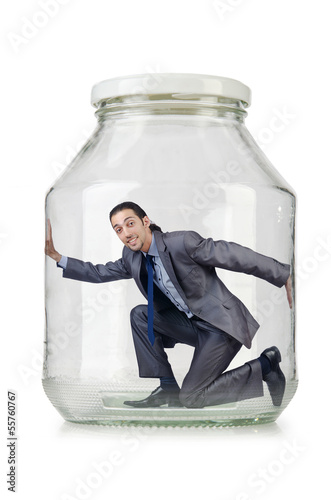 Photo: Young businessman in glass jar Young businessman in glass jar