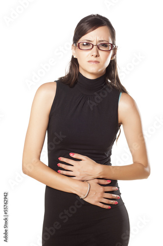Photo: young beautiful business woman has pain in her stomach young beautiful business woman has pain in her stomach