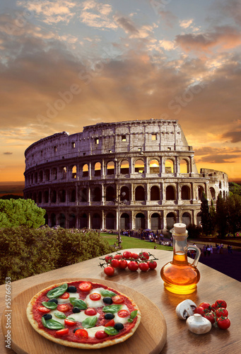 Photo: Colosseum with Italian pizza in Rome, Italy Colosseum with Italian pizza in Rome, Italy