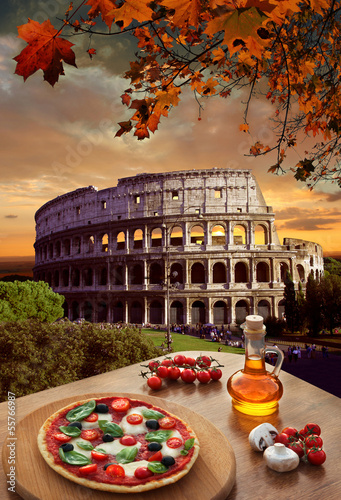 Photo: Colosseum with Italian pizza in Rome, Italy Colosseum with Italian pizza in Rome, Italy