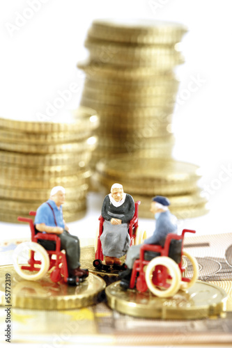 Photo: Figuren in Rollstühlen auf Münzen Figuren in Rollstühlen auf Münzen