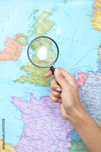 Photo: Magnifying Glass on a Map Magnifying Glass on a Map