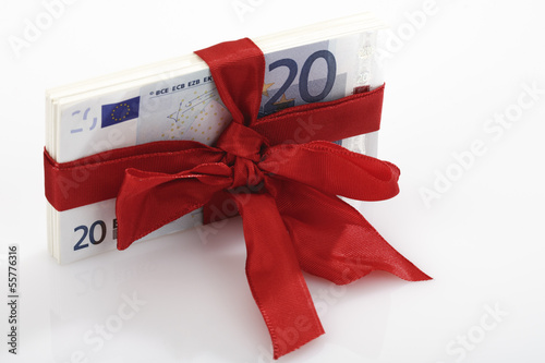 Photo: Bündel von Banknoten als Geschenk gebunden Bündel von Banknoten als Geschenk gebunden