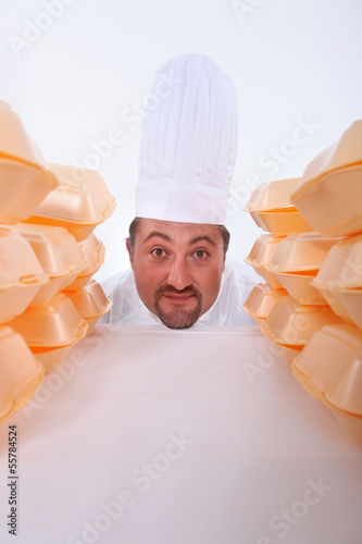 Photo: Chef with fast-food packaging Chef with fast-food packaging
