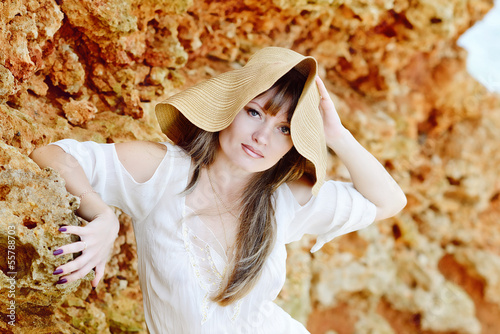 Photo: beautiful woman wearing straw hat beautiful woman wearing straw hat