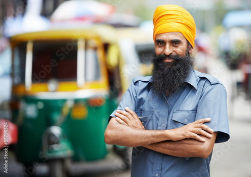 Photo: Indian auto rickshaw tut-tuk driver man Indian auto rickshaw tut-tuk driver man