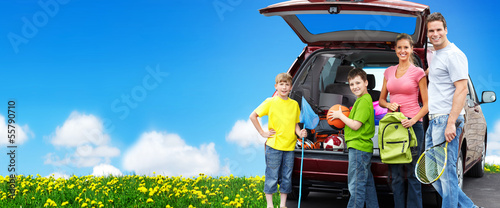 Photo: Happy family near new car. Happy family near new car.