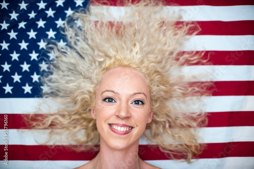 Photo: pretty wild hair woman on American flag pretty wild hair woman on American flag