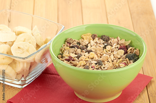 Photo: Delicious and healthy cereal in bowl with milk Delicious and healthy cereal in bowl with milk