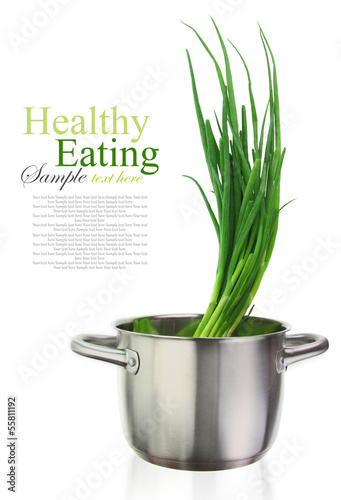 Photo: Fresh green onions in a stainless steel cooking pot Fresh green onions in a stainless steel cooking pot