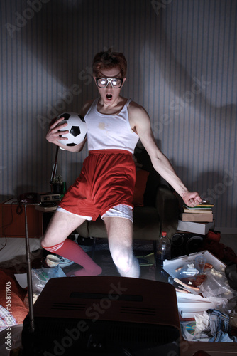 Photo: Soccer Fan Watching Television Soccer Fan Watching Television