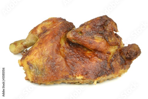 Photo: Half a grilled chicken on a white background Half a grilled chicken on a white background