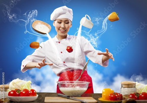Photo: Asian female cooking with magic Asian female cooking with magic