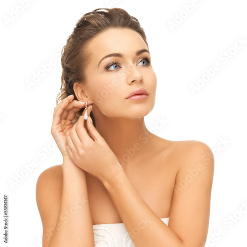 Photo: woman wearing shiny diamond earrings woman wearing shiny diamond earrings
