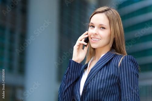 Photo: Businesswoman talking on the phone Businesswoman talking on the phone