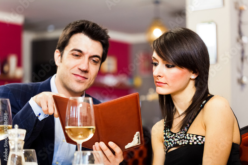 Photo: Couple reading menu Couple reading menu