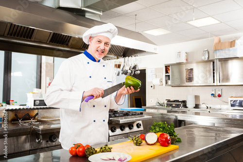 Photo: Chef cooking in his kitchen Chef cooking in his kitchen