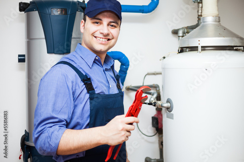 Photo: Smiling plumber at work Smiling plumber at work