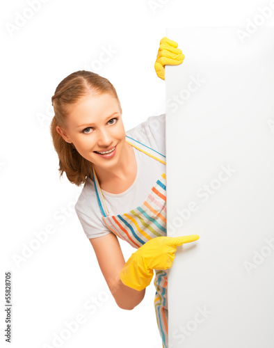 Photo: happy young housewife in glove with white empty billboard isolat happy young housewife in glove with white empty billboard isolat