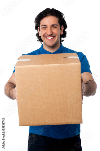 Photo: Man carrying cardboard box Man carrying cardboard box
