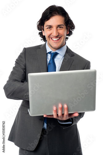 Photo: Businessman operating his laptop Businessman operating his laptop