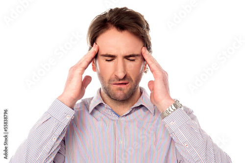 Photo: Man having severe headache Man having severe headache