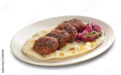 Photo: Meatballs on grilled tortilla with red onions Meatballs on grilled tortilla with red onions