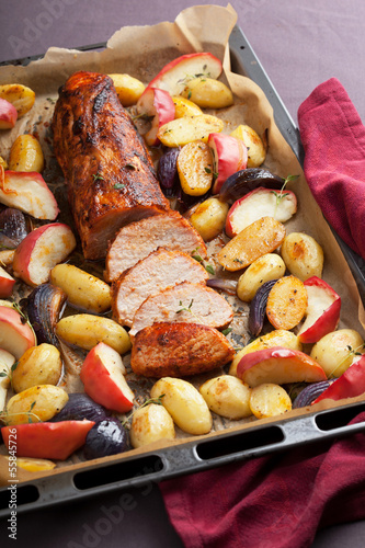 Photo: pork baked with vegetables on a tray pork baked with vegetables on a tray