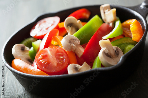 Photo: colorful vegetables in black pan ready for frying colorful vegetables in black pan ready for frying