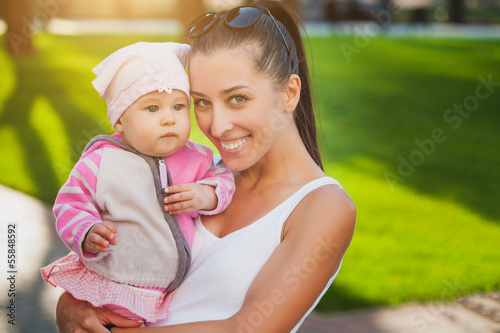 Photo: mom and baby in the park mom and baby in the park
