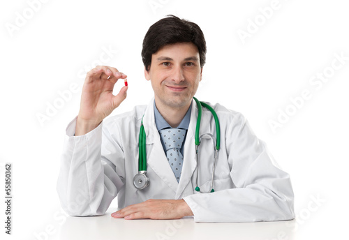 Photo: doctor shows a pill doctor shows a pill
