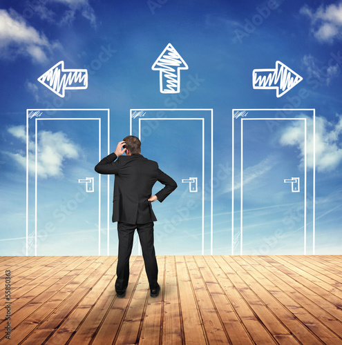 Photo: Businessman thinking about Decision Businessman thinking about Decision
