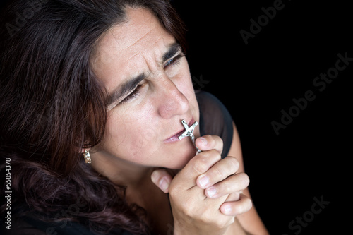 Photo: Emotional portrait of an hispanic woman praying Emotional portrait of an hispanic woman praying