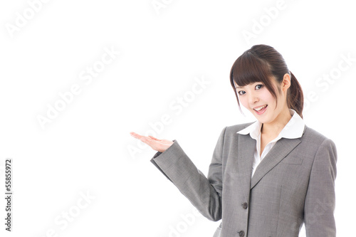 Photo: young businesswoman showing on white background young businesswoman showing on white background
