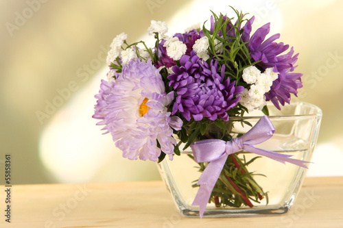Photo: Beautiful bouquet of bright flowers in glass vase, Beautiful bouquet of bright flowers in glass vase,