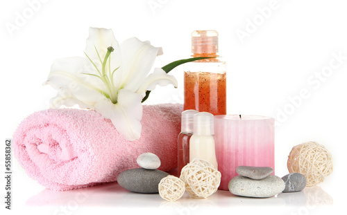 Photo: Beautiful spa setting with lily isolated on white Beautiful spa setting with lily isolated on white
