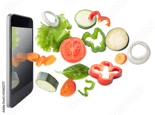 Photo: Vegetables and tablet, isolated. Recipes application concept. Vegetables and tablet, isolated. Recipes application concept.