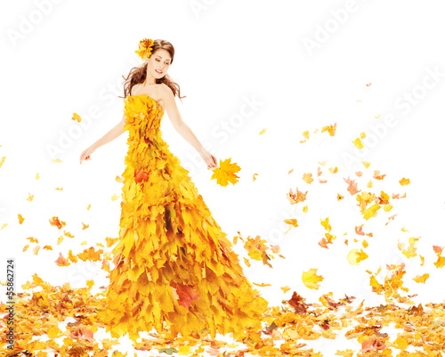 Photo: Autumn woman in yellow dress of maple leaves Autumn woman in yellow dress of maple leaves
