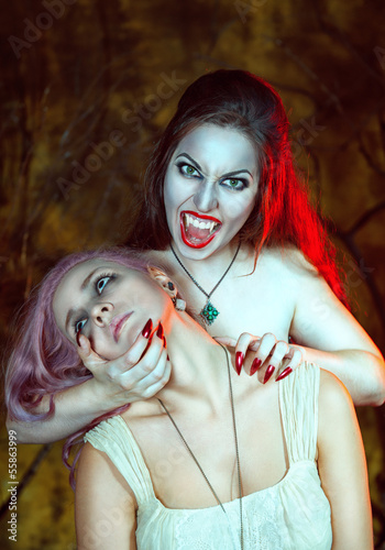 Photo: Beautiful vampire and her victim Beautiful vampire and her victim