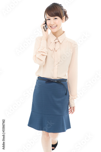 Photo: Beautiful asian business woman using a cellular Beautiful asian business woman using a cellular