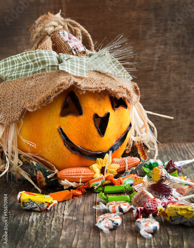 Photo: Jack-o-lantern and Halloween candy Jack-o-lantern and Halloween candy