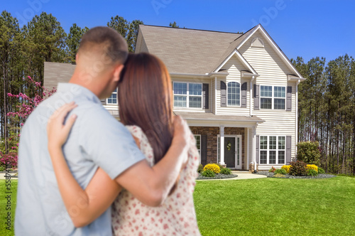 Photo: Military Couple Looking at Nice New House Military Couple Looking at Nice New House