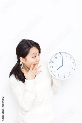 Photo: 時計を見て驚く女性 時計を見て驚く女性