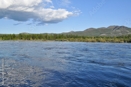 Photo: Landscape with reflection of clouds in the river. Landscape with reflection of clouds in the river.